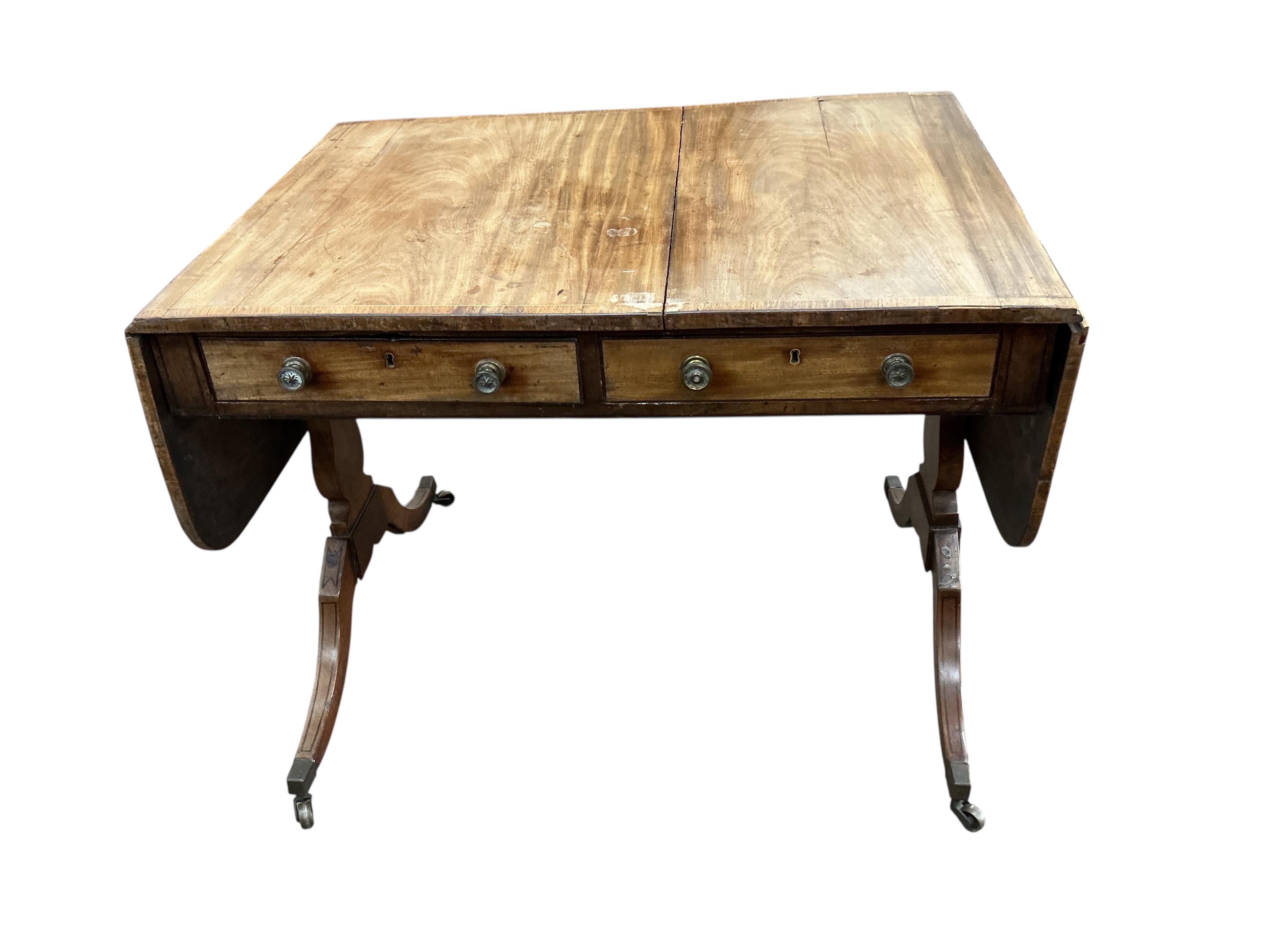 A Regency banded mahogany sofa table, damaged, width 89cm, depth 65cm, height 71cm